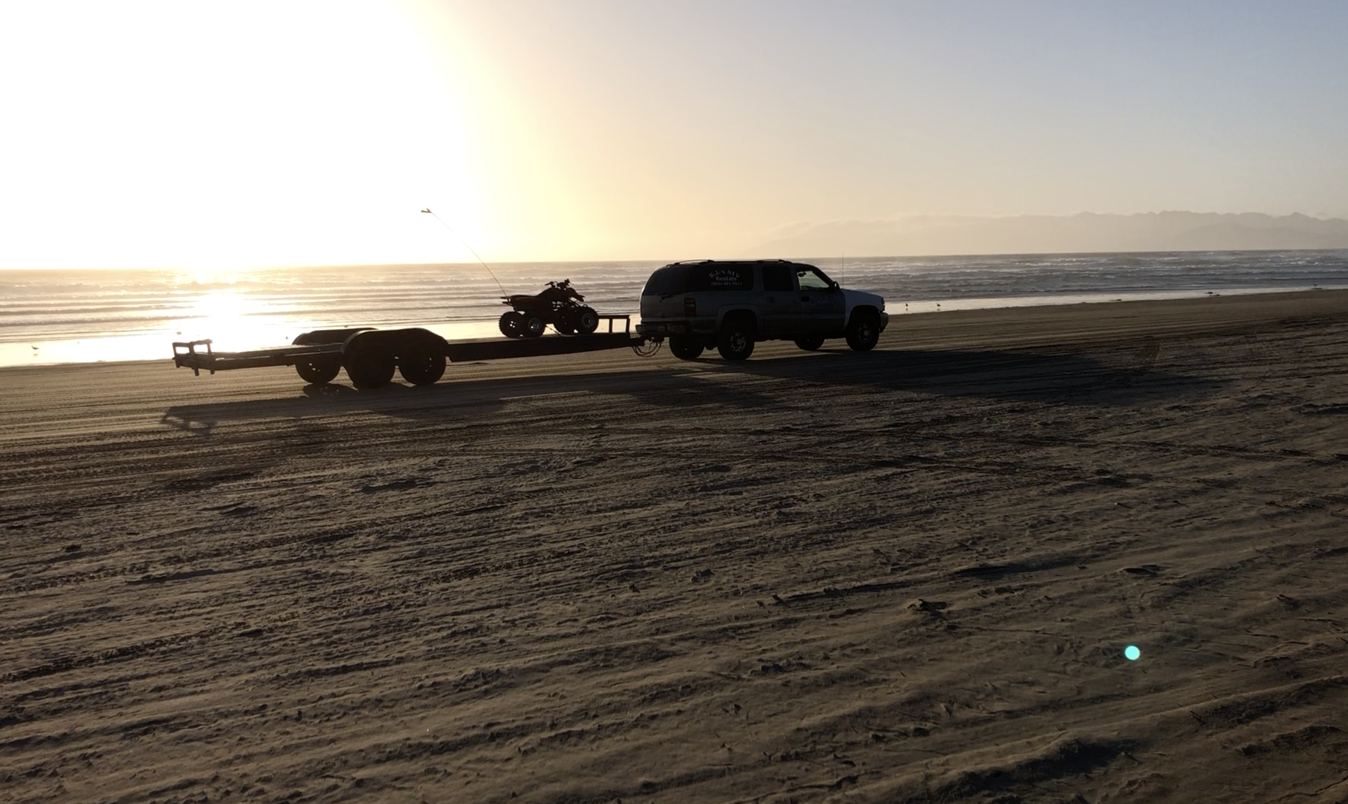 Vehicle driving on beach